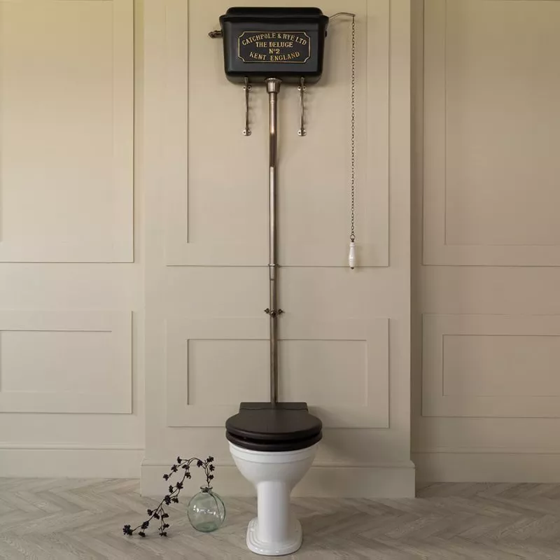 The Deluge High Level Cistern Charcoal_Brass Lettering Cream Wall Dressed