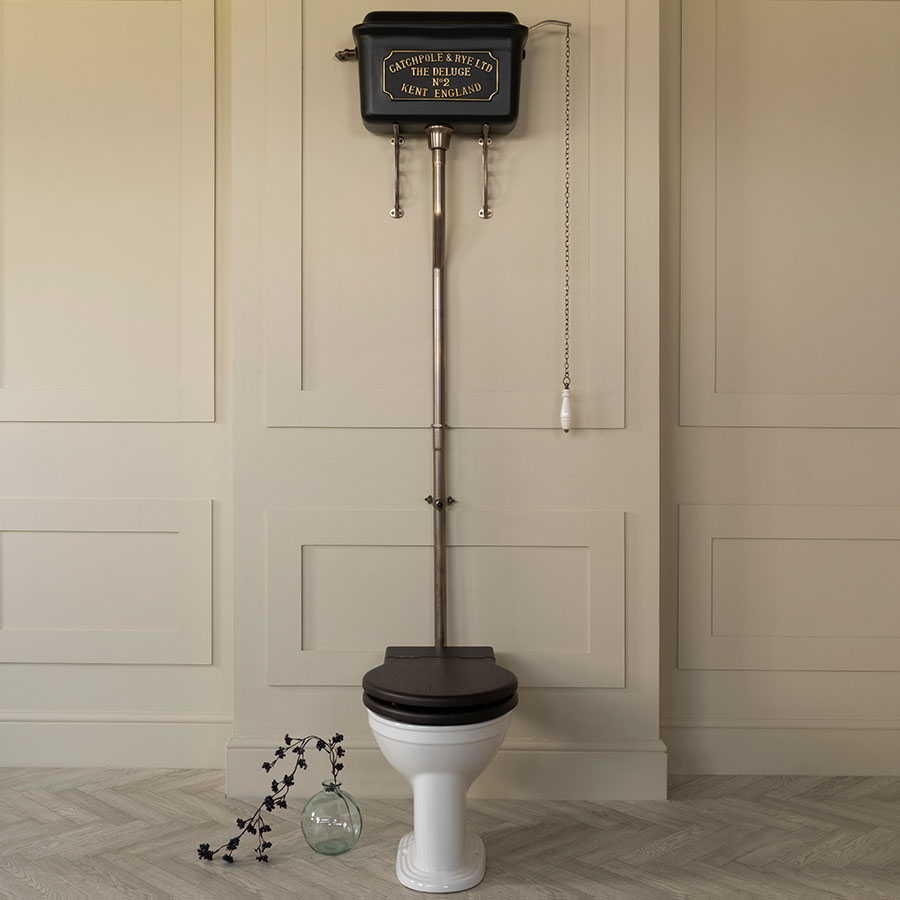 The Deluge High Level Cistern Charcoal_Brass Lettering Cream Wall Dressed
