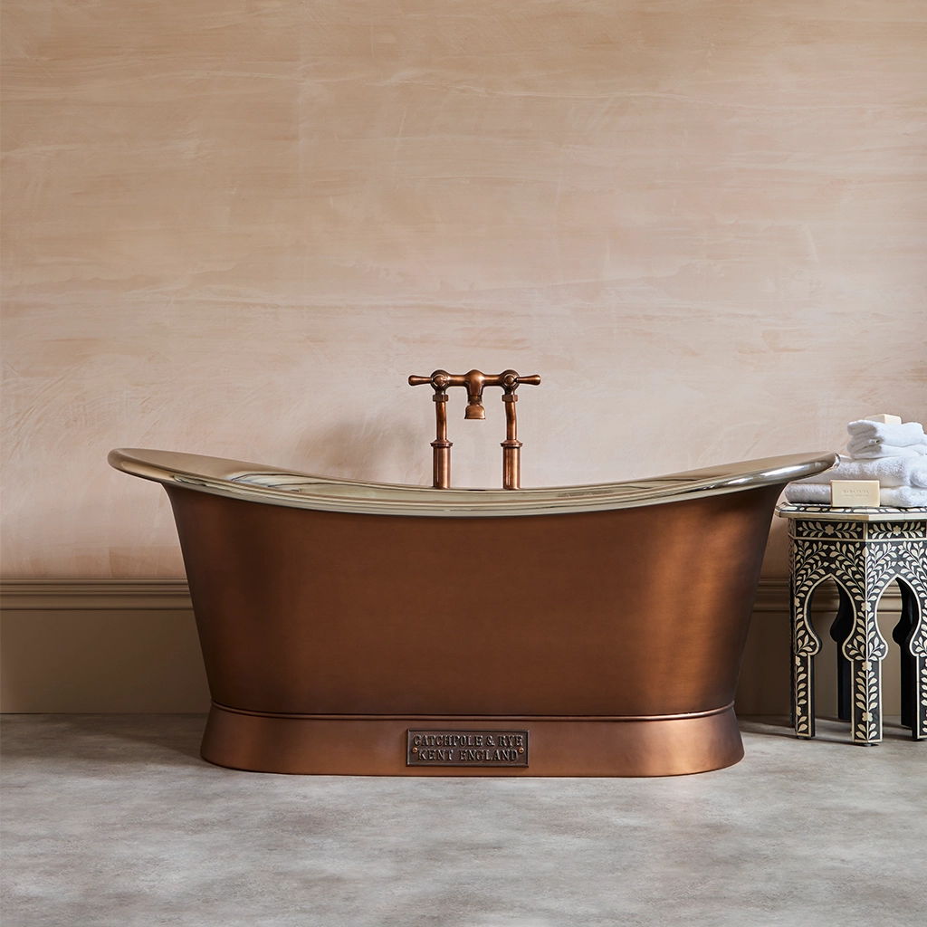 Freestanding Traditional Copper Bath with bath filler on standpipes