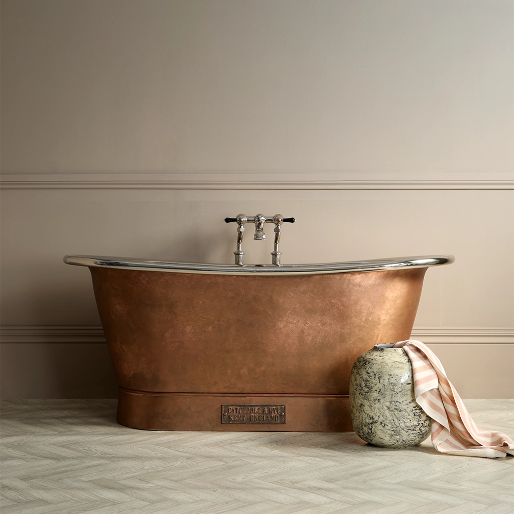 Freestanding Weathered Traditional Copper Bath with bath filler on standpipes