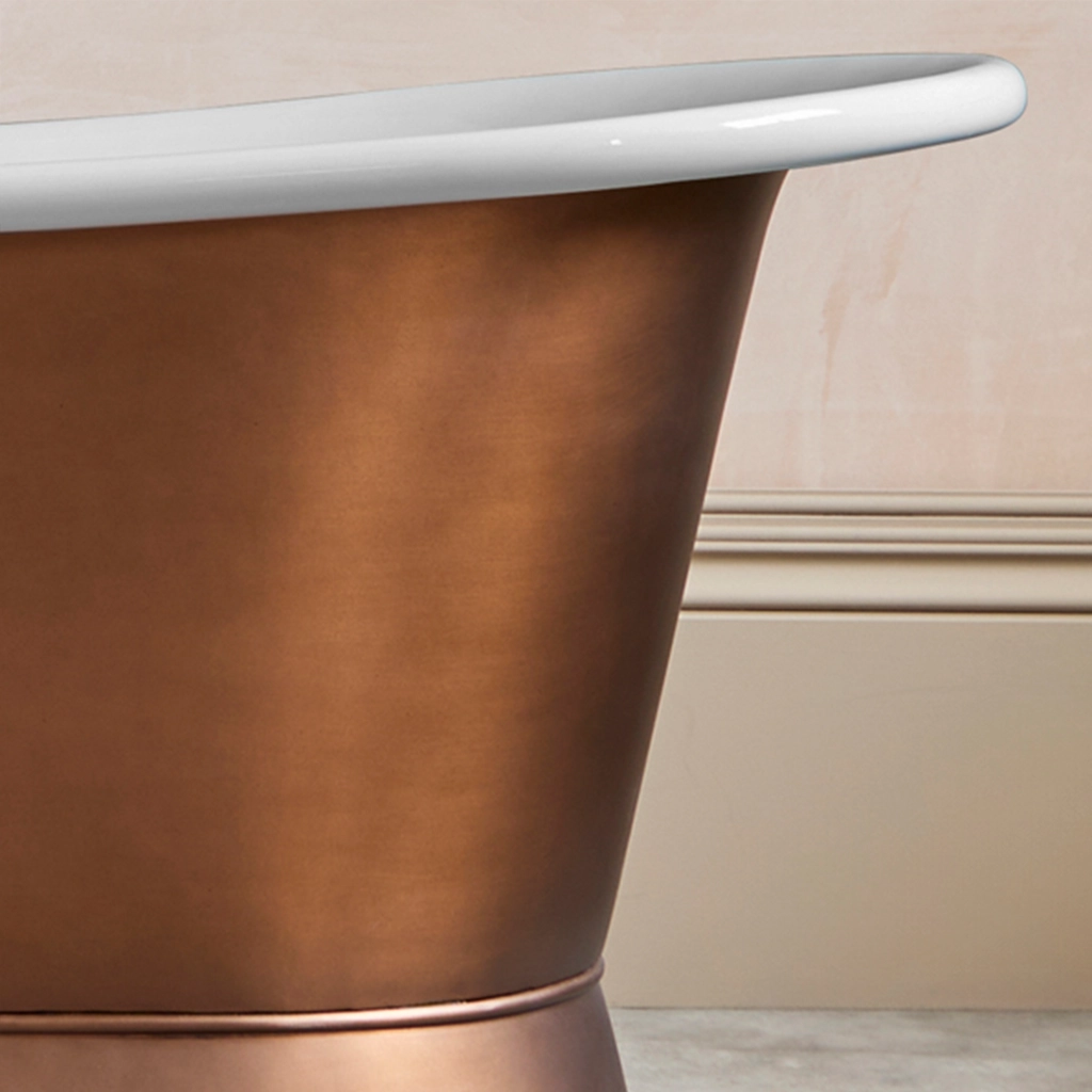 Freestanding Weathered Traditional Copper Bath with bath filler on standpipes
