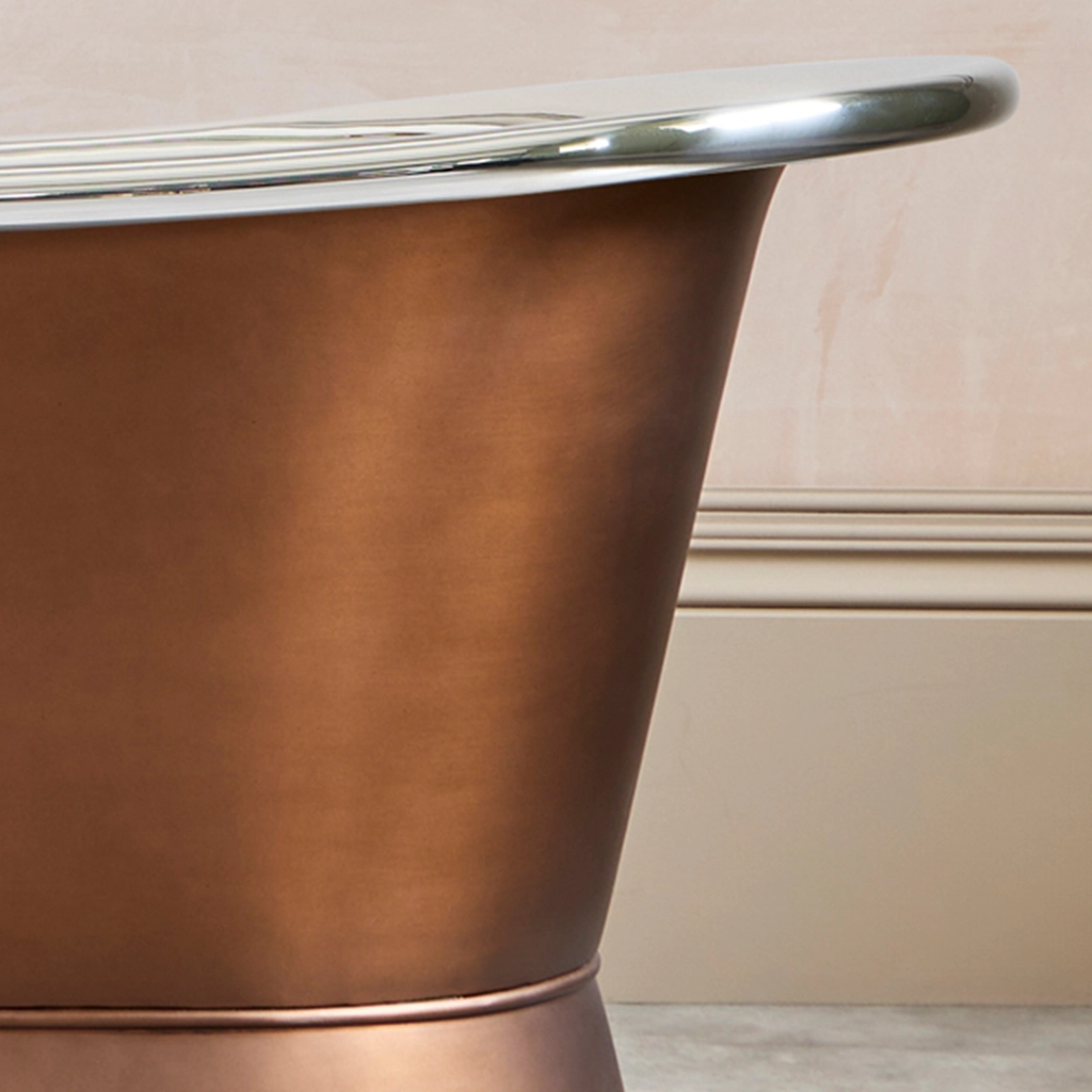 Freestanding Weathered Traditional Copper Bath with bath filler on standpipes