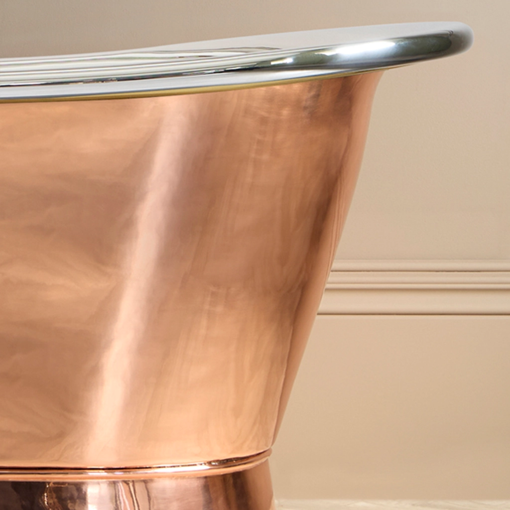 Freestanding Weathered Traditional Copper Bath with bath filler on standpipes