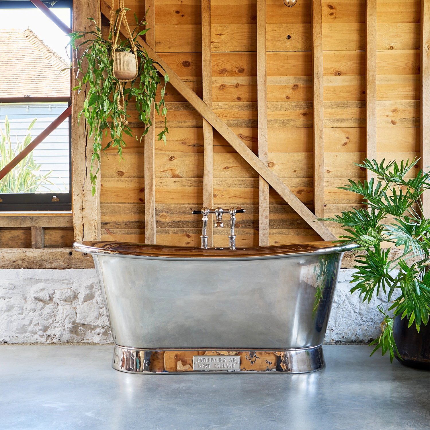 Freestanding Nickel Bath Traditional roll top with bath filler on standpipes
