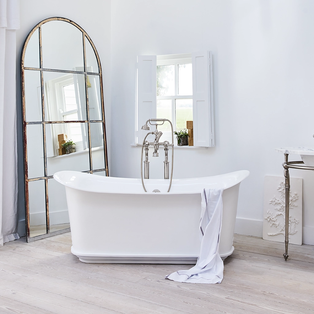 Freestanding Traditional Cast Iron Bathtub with bath filler on standpipes