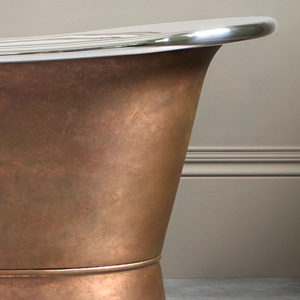 Freestanding Weathered Traditional Copper Bath with bath filler on standpipes
