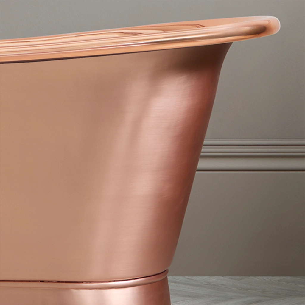 Freestanding Weathered Traditional Copper Bath with bath filler on standpipes