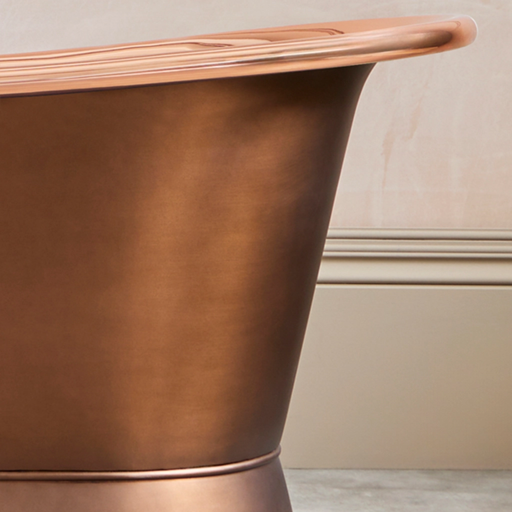 Freestanding Weathered Traditional Copper Bath with bath filler on standpipes