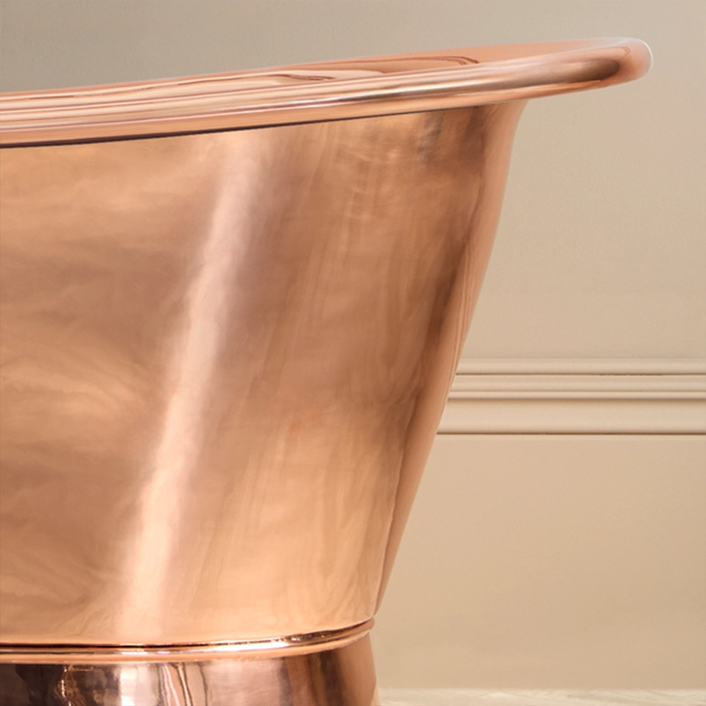 Freestanding Weathered Traditional Copper Bath with bath filler on standpipes