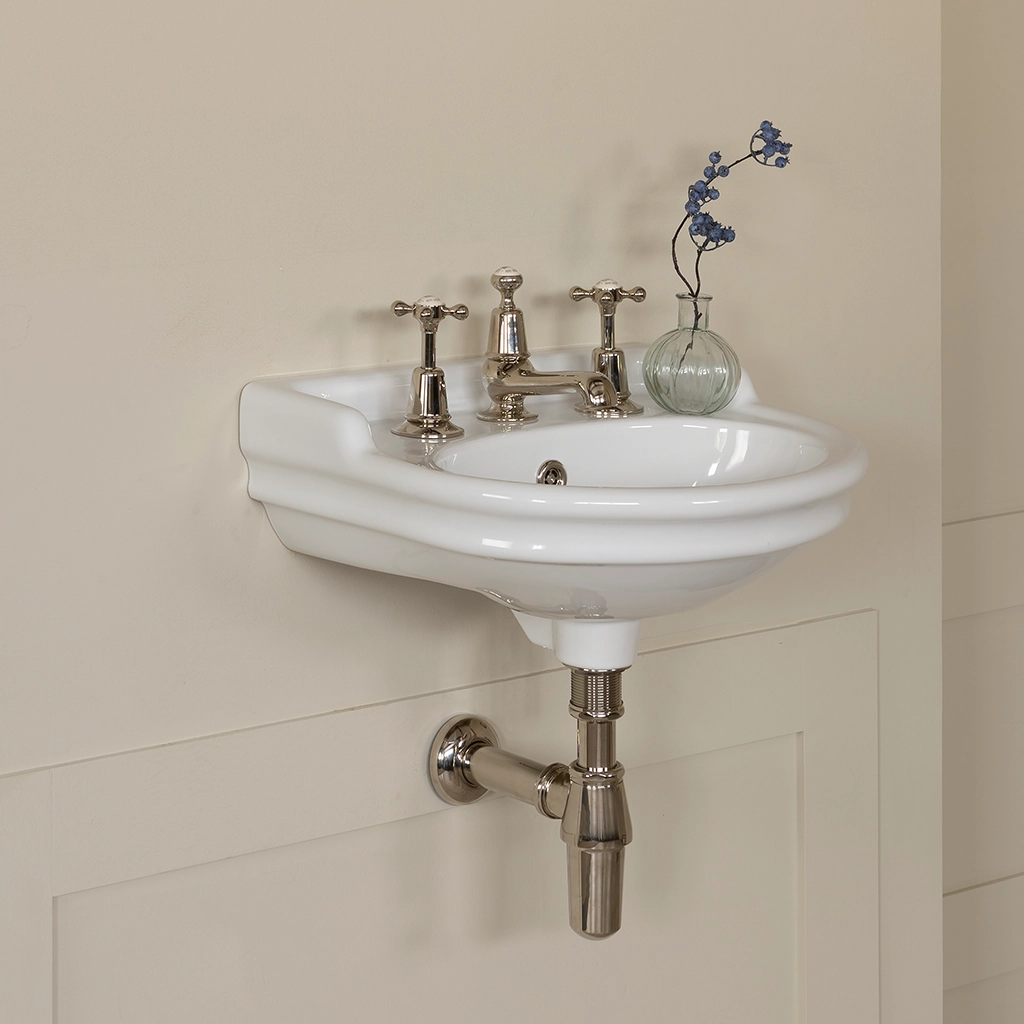 Ceramic cloakroom basin with overflow available in a number of brassware finishes