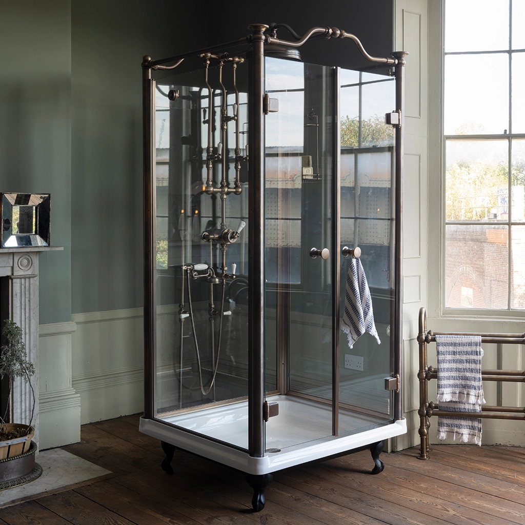 Luxury walk in shower. Freestanding glass enclosure and cast metal tray. Traditional freestanding shower