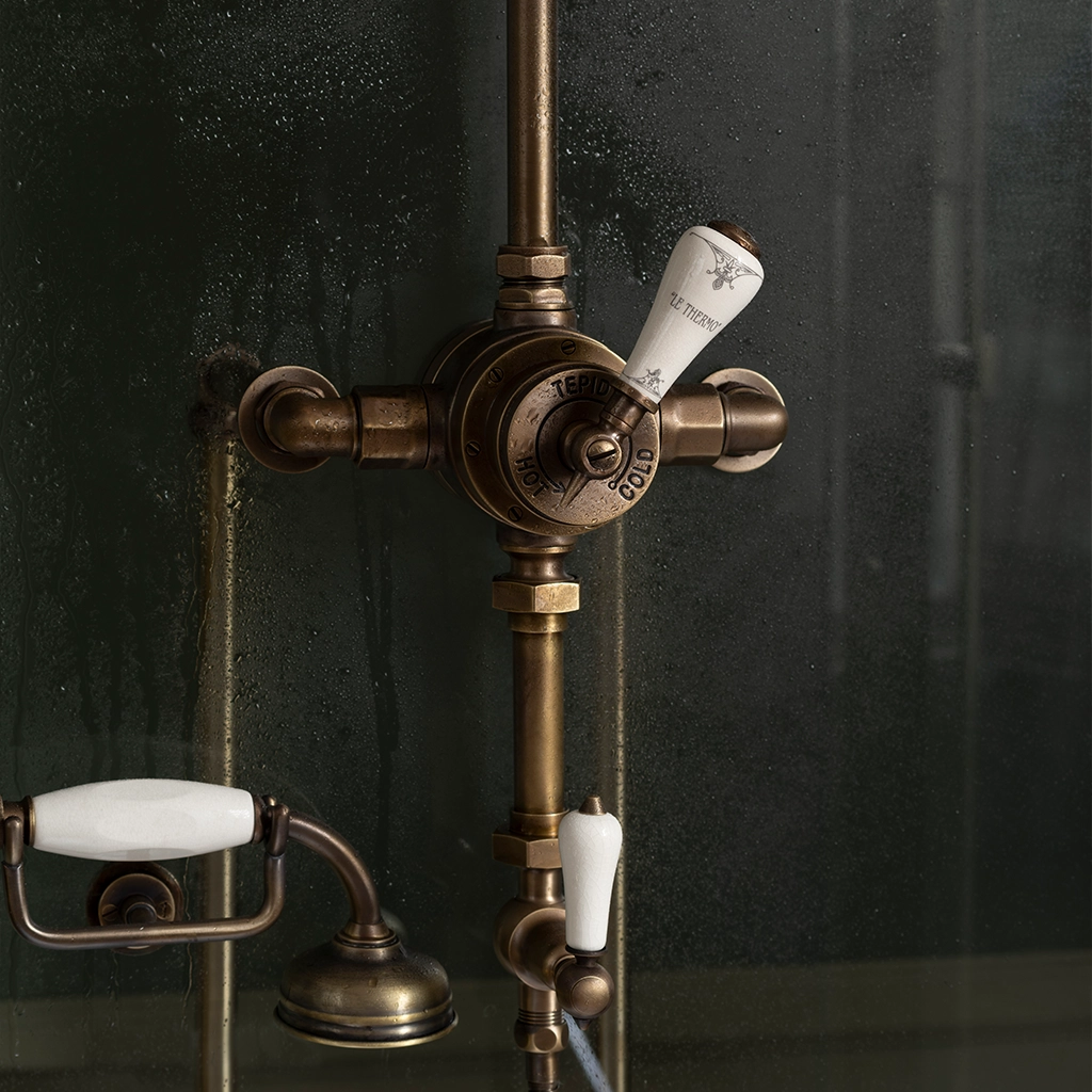 Luxury walk in shower. Freestanding glass enclosure and cast metal tray. Traditional freestanding shower