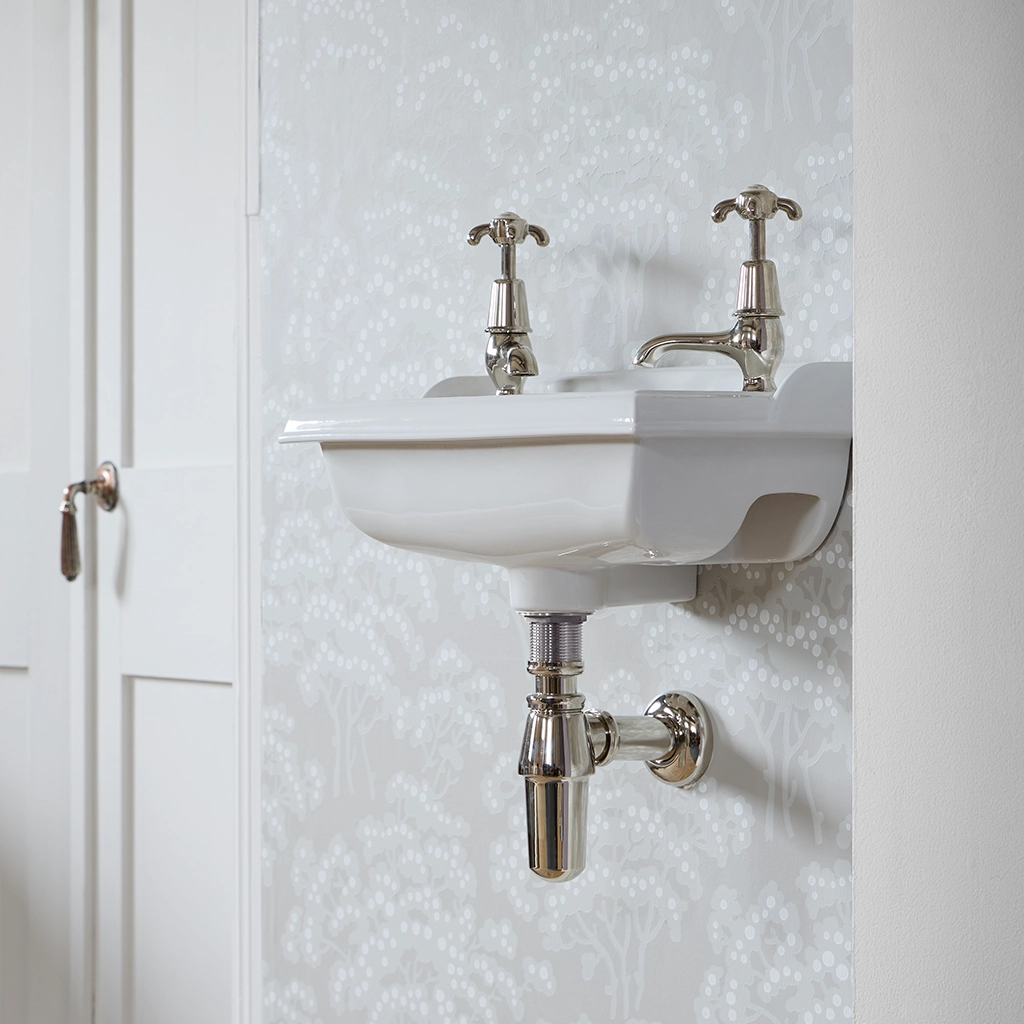 Ceramic cloakroom basin with overflow available in a number of brassware finishes
