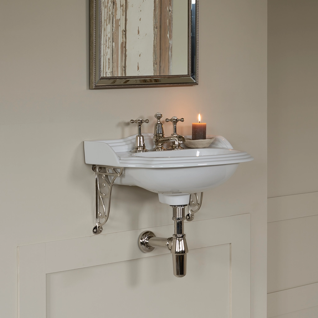 Ceramic cloakroom basin with overflow available in a number of brassware finishes