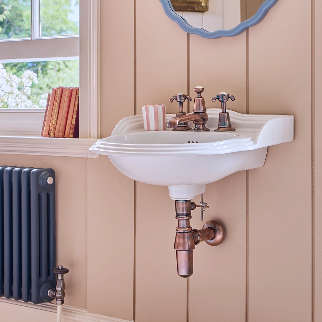 Ceramic cloakroom basin with overflow available in a number of brassware finishes