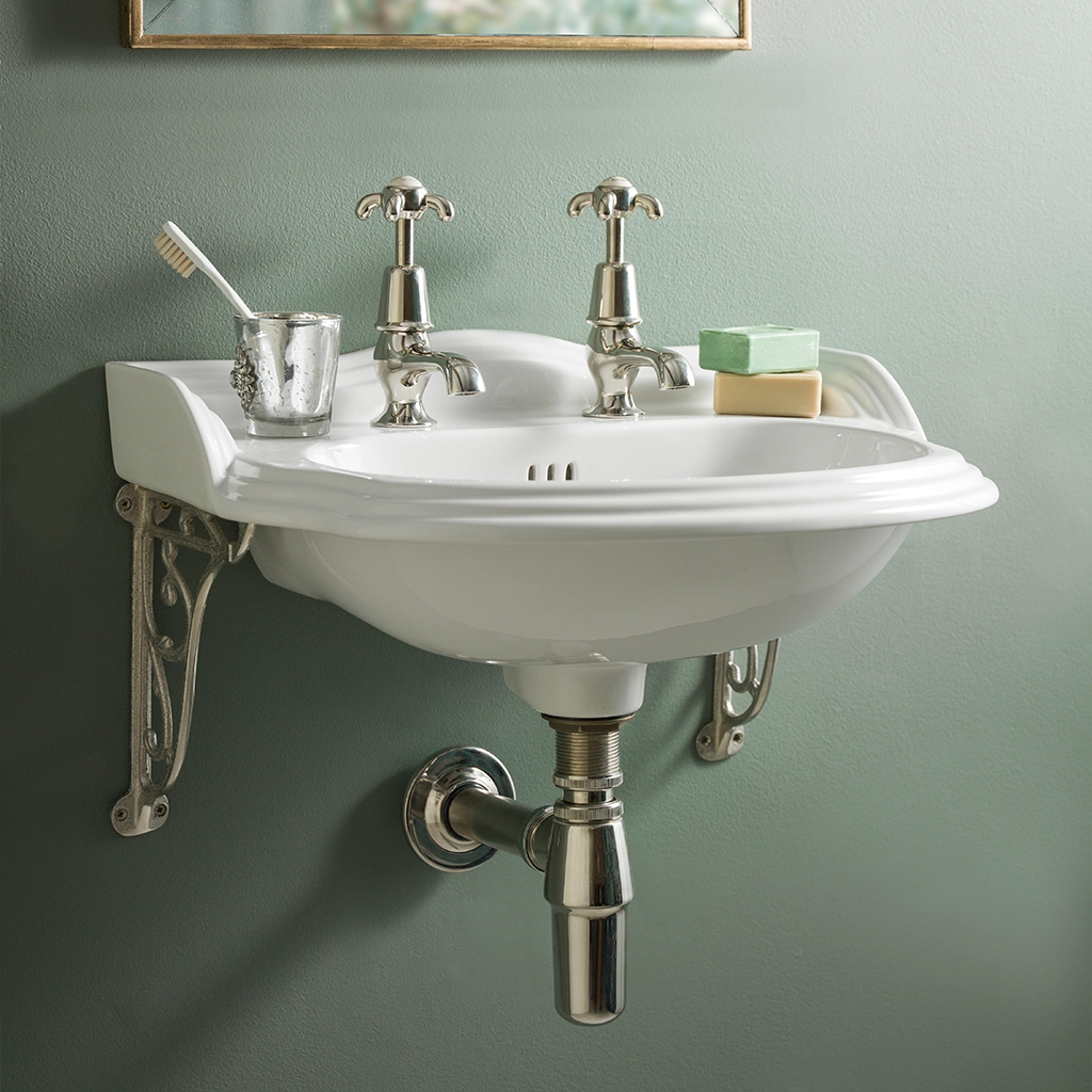 Ceramic cloakroom basin with overflow available in a number of brassware finishes