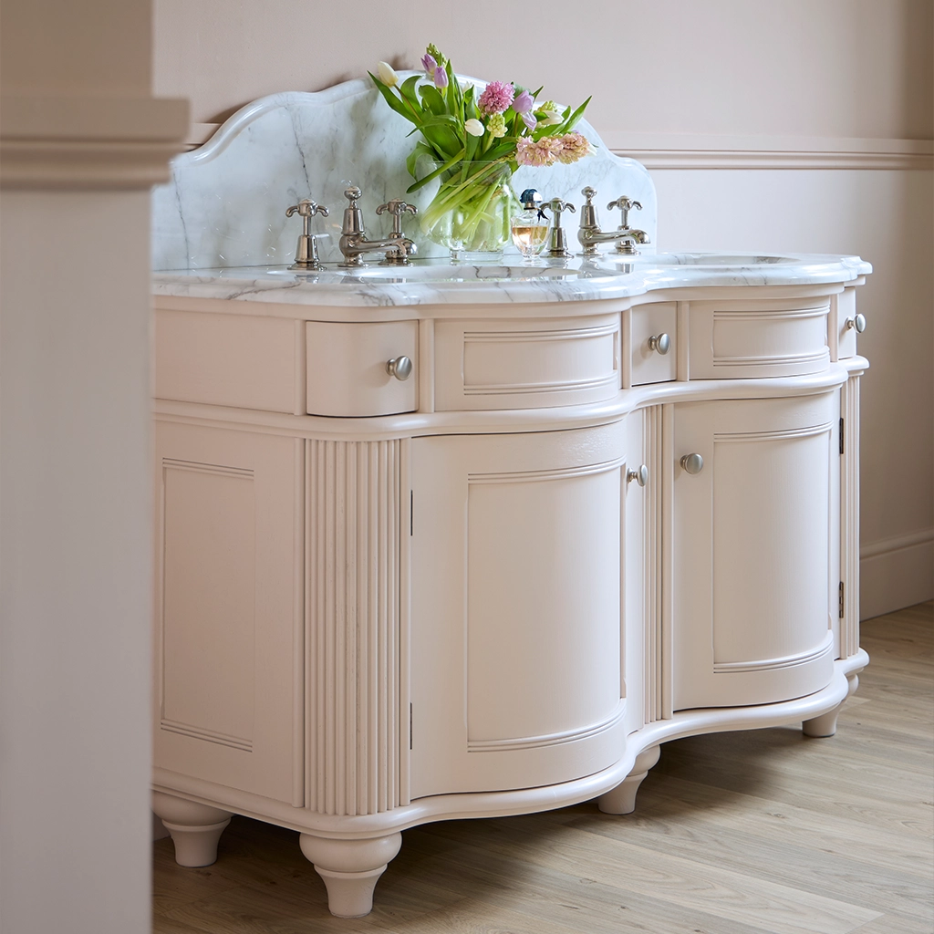 Double wooden vanity unit with amble bathroom storage and marble splashback
