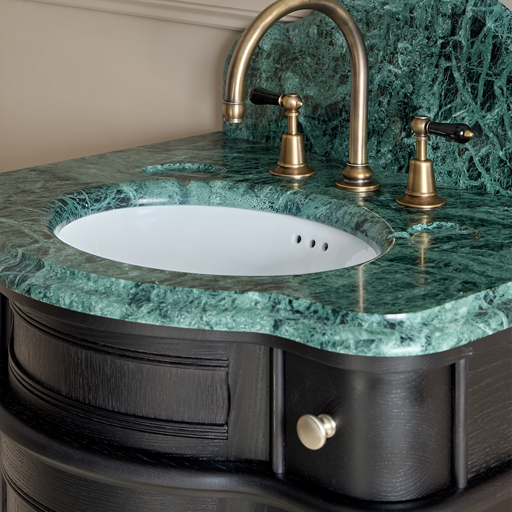 Single wooden vanity unit with amble bathroom storage and marble splashback