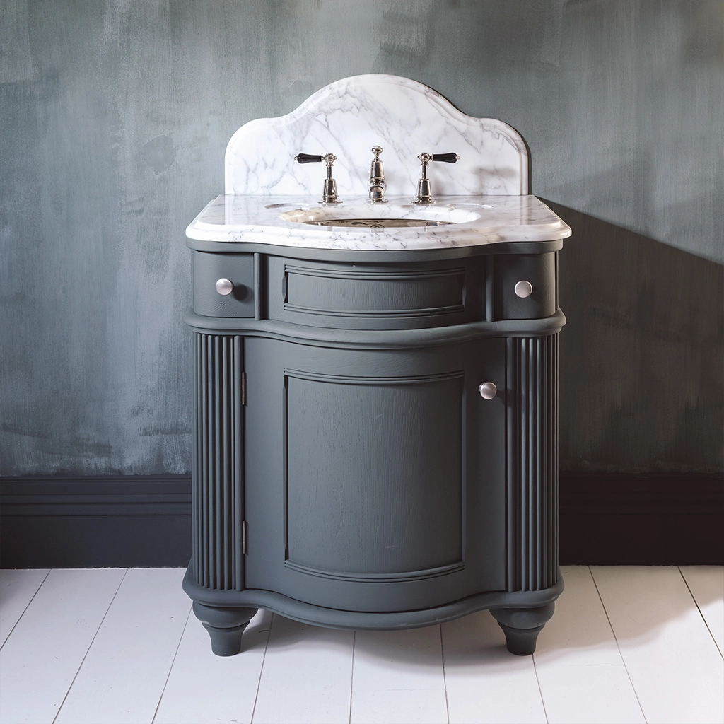 Single wooden vanity unit with amble bathroom storage and marble splashback