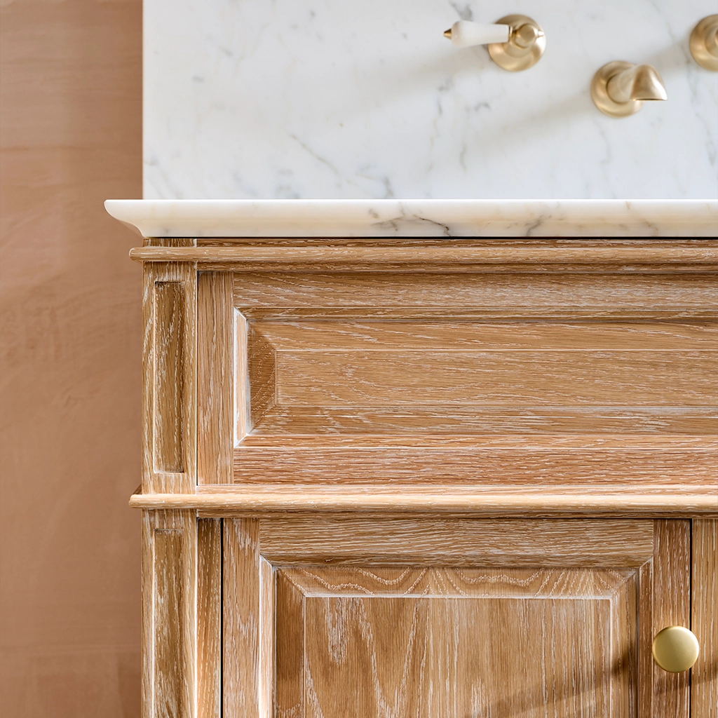 Single wooden vanity unit with amble bathroom storage and marble splashback