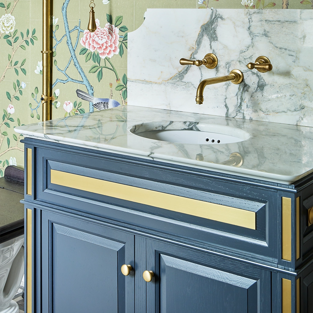 Single wooden vanity unit with amble bathroom storage and marble splashback