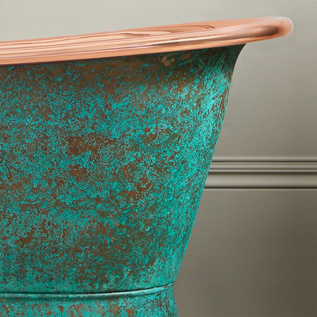 Freestanding Weathered Traditional Copper Bath with bath filler on standpipes