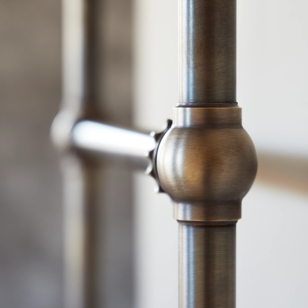 The Mercantile Wall Mounted is an exclusive brass heated towel rail with a short, ladder-style frame and unique design.