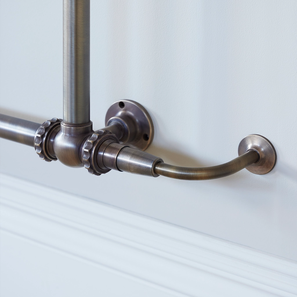 The Mercantile Wall Mounted is an exclusive brass heated towel rail with a short, ladder-style frame and unique design.