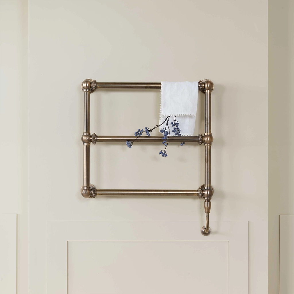 The Mercantile Wall Mounted is an exclusive brass heated towel rail with a short, ladder-style frame and unique design.