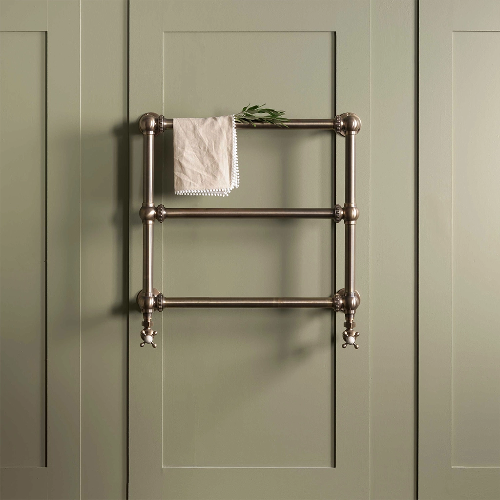 The Mercantile Wall Mounted is an exclusive brass heated towel rail with a short, ladder-style frame and unique design.