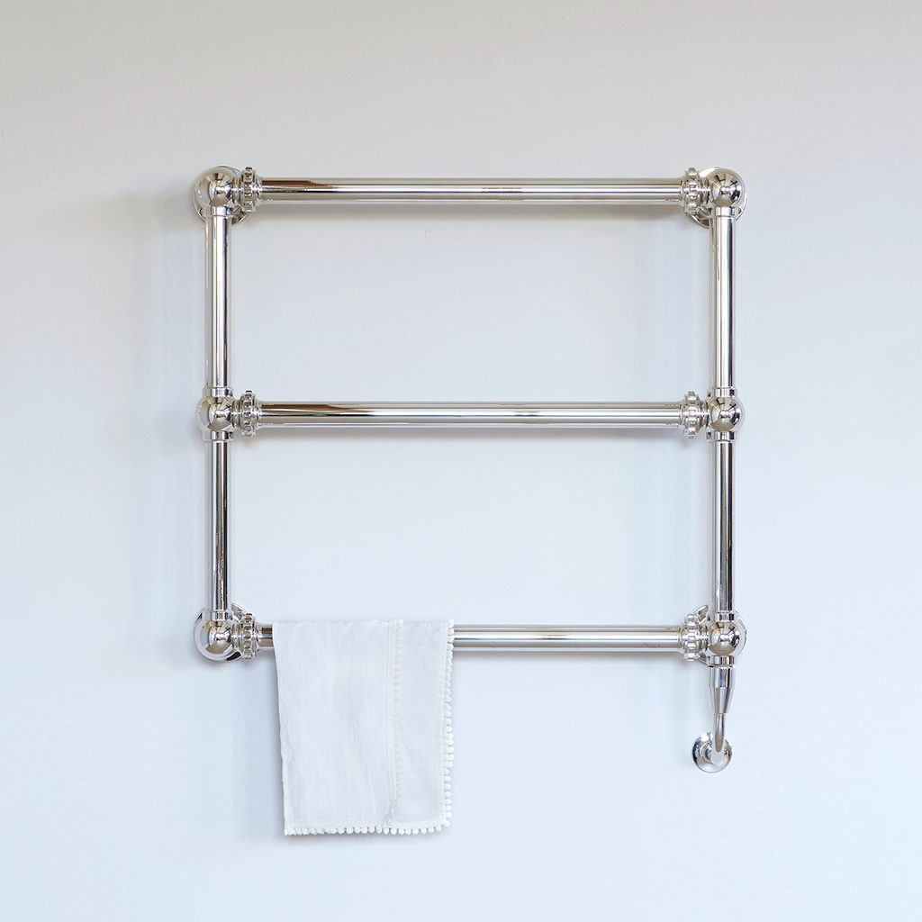 The Mercantile Wall Mounted is an exclusive brass heated towel rail with a short, ladder-style frame and unique design.