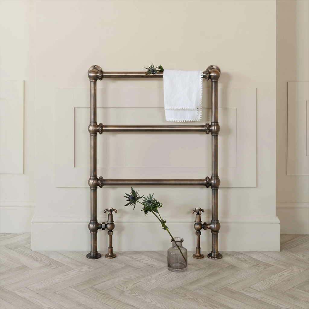 Magnificent in its stature, The Mercantile Three Bar is an exclusive brass heated towel rail with a short, ladder style frame and unique design elements.