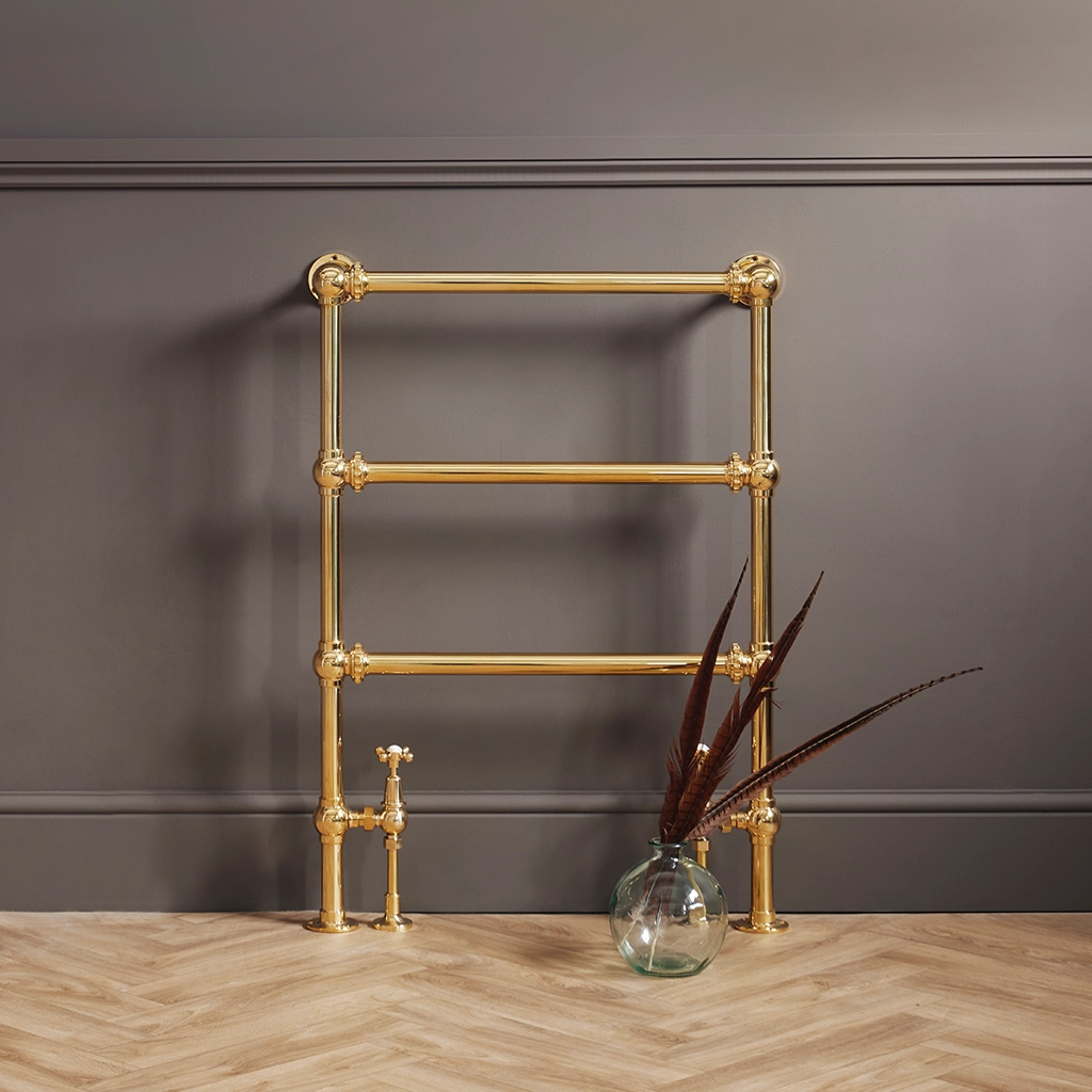 Magnificent in its stature, The Mercantile Three Bar is an exclusive brass heated towel rail with a short, ladder style frame and unique design elements.