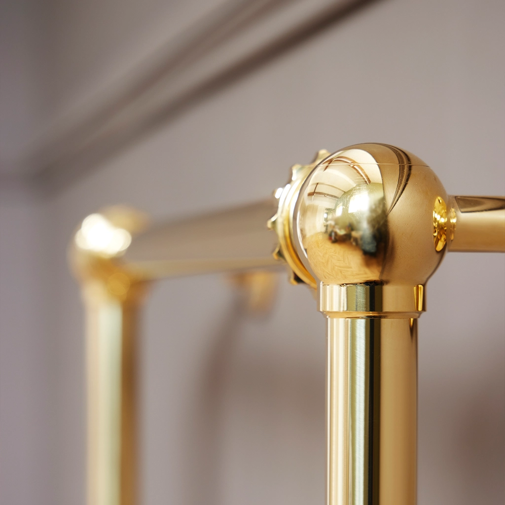 Magnificent in its stature, The Mercantile Three Bar is an exclusive brass heated towel rail with a short, ladder style frame and unique design elements.