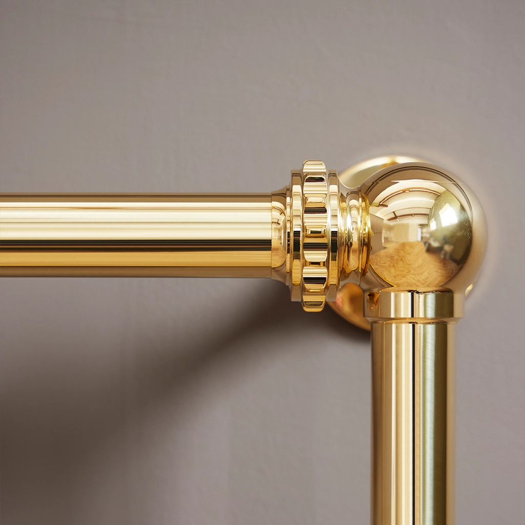 Magnificent in its stature, The Mercantile Three Bar is an exclusive brass heated towel rail with a short, ladder style frame and unique design elements.