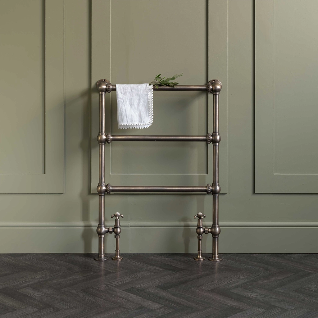 Magnificent in its stature, The Mercantile Three Bar is an exclusive brass heated towel rail with a short, ladder style frame and unique design elements.